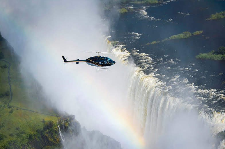 Guide and guests at a Victoria Falls viewpoint